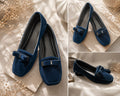 Three views of a pair of navy blue velvet loafers with a bow and silver buckle, styled on a beige fabric background with dried flowers.